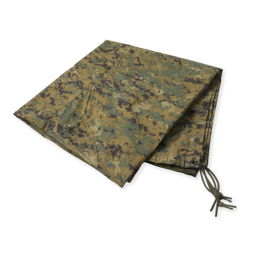 A folded camouflage tarp with a digital woodland pattern in green, brown, and tan, featuring a drawstring cord on one corner, shown against a plain white background.