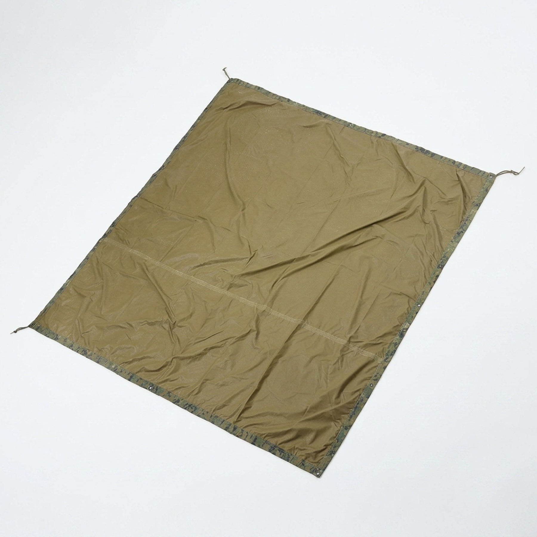 A wrinkled olive green canvas tarp or tent sheet laid flat on a clean white background.